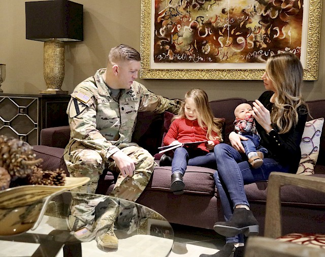 Army Lt. Col. Patrick "Pat" Miller and his family visit the Madigan Army Medical Center Fisher House at Joint Base Lewis-McChord. Pat's family stayed at the Fort Hood Carl R. Darnall Army Medical Center Fisher House when Pat was shot during an active shooter situation on the base.